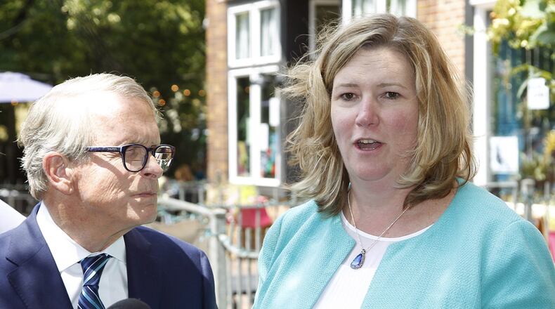 Ohio Governor Mike DeWine is shown in a joint press conference with Dayton Mayor Nan Whaley on Aug. 8 in the Oregon District to talk about mental health initiatives in the wake of the mass shooting that took place on Aug. 4, 2019. DeWine signed a bill that no longer requires Ohioans to first consider retreating in public spaces before using deadly force in self defense. Whaley has criticized the bill and said DeWine has failed to advance reforms he proposed after Dayton's mass shooting.  TY GREENLEES / STAFF