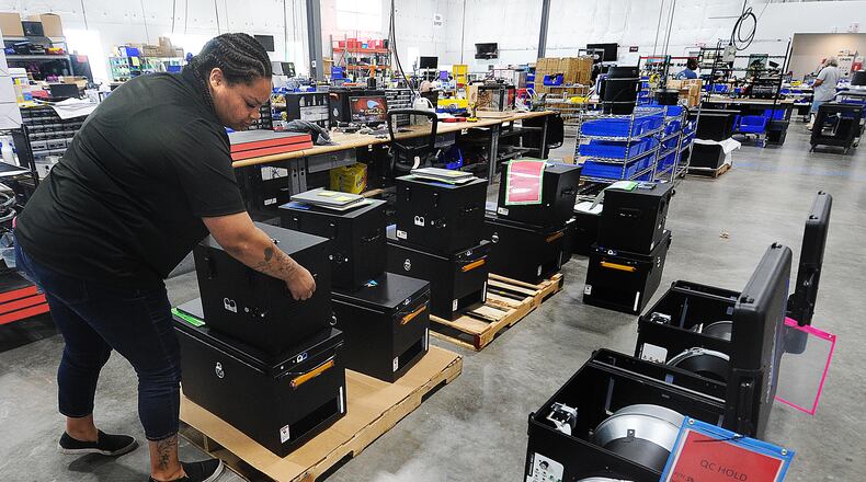 Aeroseal employee Kat Adams works in production. MARSHALL GORBY/STAFF