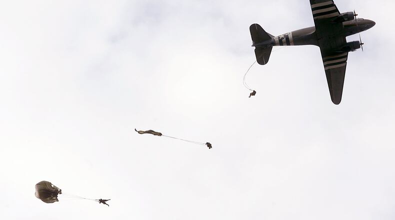FILE: Parachutists exit a C-47 airplane in a D-Day paratrooper demonstration during the Wings of Freedom air show at Hook Field in Middletown, Ohio Saturday Sept. 20, 2008. Staff photo by Pat Auckerman
