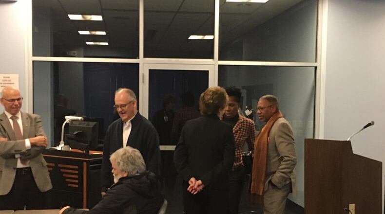 Dayton Public Schools facilities task force co-chair Jeff Mims (right) talks to Acting Superintendent Elizabeth Lolli and district spokeswoman Marsha Bonhart before last month’s scheduled task force meeting. The meeting was canceled when members of the media, including the Dayton Daily News and WHIO, objected to the meeting being closed to the public. STAFF/JEREMY P. KELLEY
