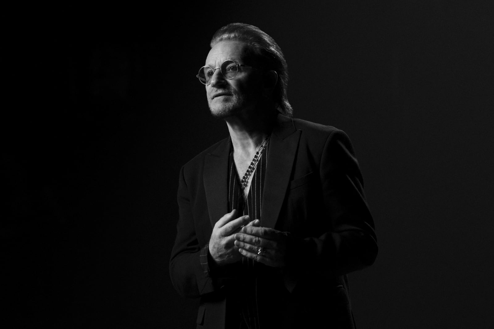 This image released by Apple TV+ shows Bono, lead singer of the Irish rock band U2, in a scene from the documentary “Bono: Stories of Surrender." (Apple TV+ via AP)