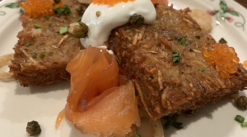 Ambrose and Eve loaded hash brown ($13) dressed up with smoked salmon, fried pickled onion, capers, creme fraiche and caviar. CONTRIBUTED PHOTO BY ALEXIS LARSEN