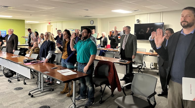 Dozens of people are sworn in to speak at a Dayton Board of Zoning Appeals hearing Tuesday, March 22, 2022. CORNELIUS FROLIK / STAFF