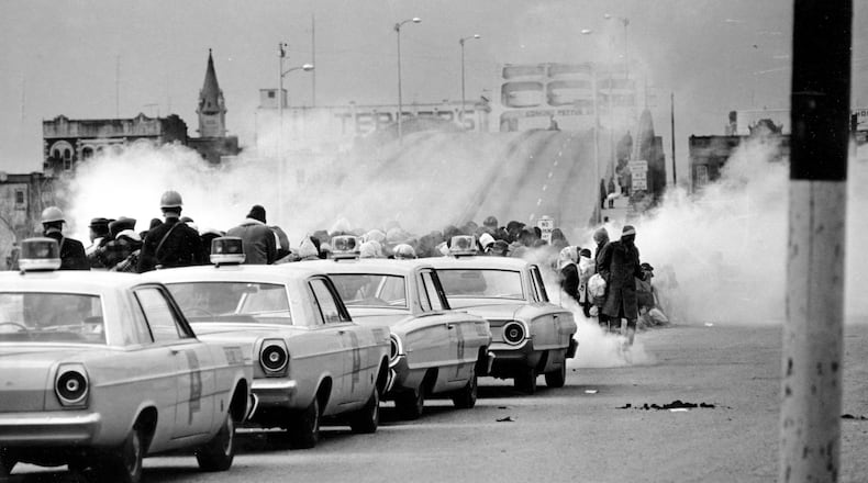 March 7, 1965: clouds of tear gas fill the air as state troopers, ordered by Gov. George Wallace, break up a demonstration march in Selma, Ala., on what became known as "Bloody Sunday." The Journal and Constitution chose not to send staff reporters to cover some of the biggest moments of the civil rights movement. (AP Photo/File)