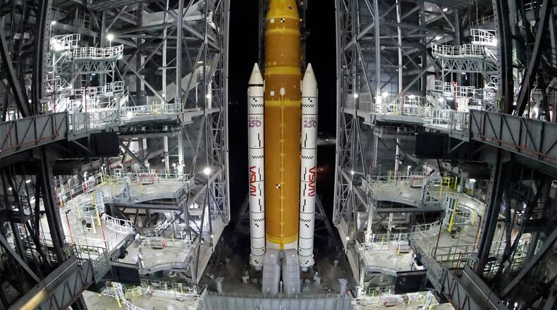 The NASA Artemis II rocket with the Orion spacecraft aboard leaves the Vehicle Assembly Building moving slowly to pad 39B at the Kennedy Space Center in Cape Canaveral, Fla., Friday, March 20, 2026. (AP Photo/Terry Renna)