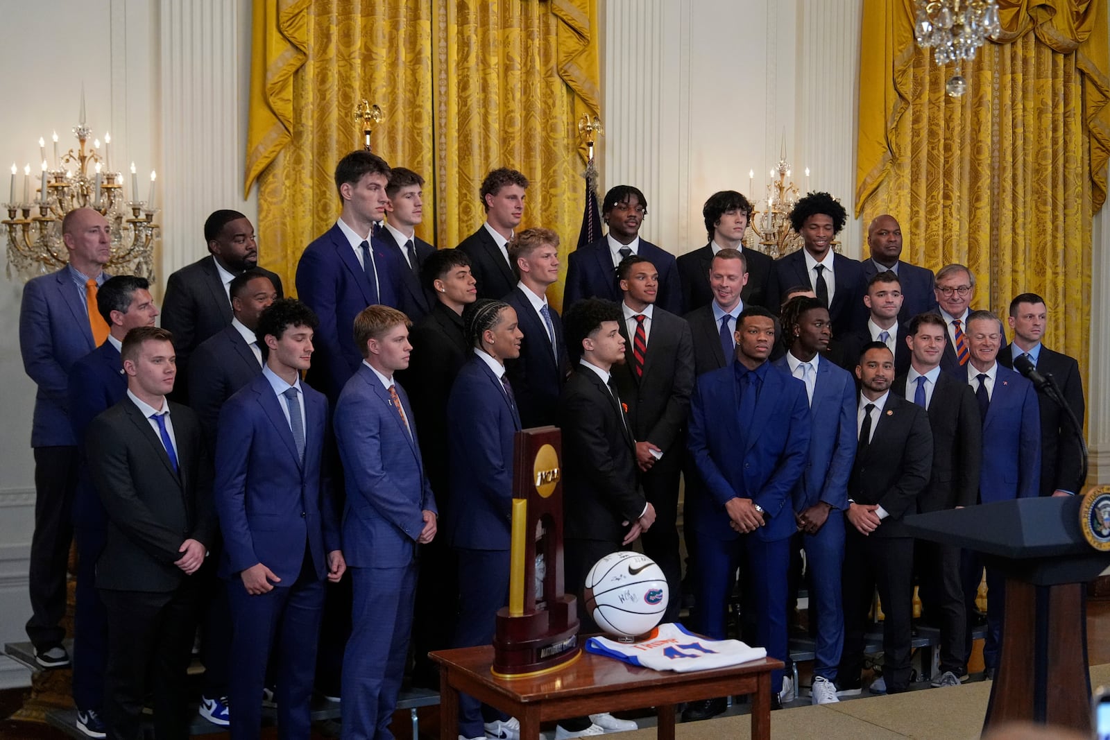 Members of the team arrive on stage as President Donald Trump hosts the 2025 NCAA Champion, University of Florida men's basketball team in the East Room of the White House, Wednesday, May 21, 2025, in Washington. (AP Photo/Julia Demaree Nikhinson)