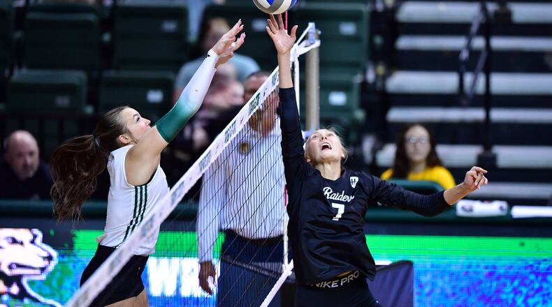 Wright State University junior Lauren Yacobucci tips the ball over the net during their match against Ohio University on Sunday, Sept. 14 at the Nutter Center in Fairborn. JOSEPH R. CRAVEN / WRIGHT STATE ATHLETICS