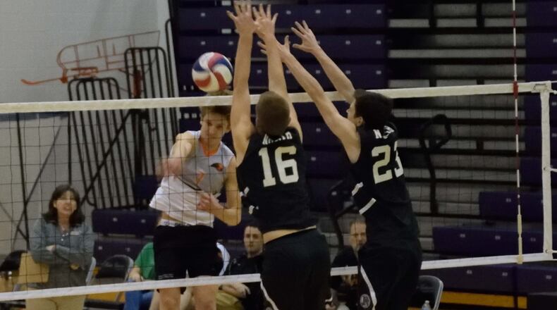 Beavercreek’s Parker Mikesch (left) makes a slam at Fairmont. CONTRIBUTED PHOTO
