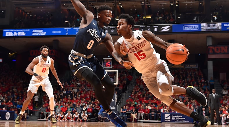 Dayton’s John Crosby drives past an Akron defender on Saturday, Nov. 25, 2017, at UD Arena. ERIK SCHELKUN / CONTRIBUTED