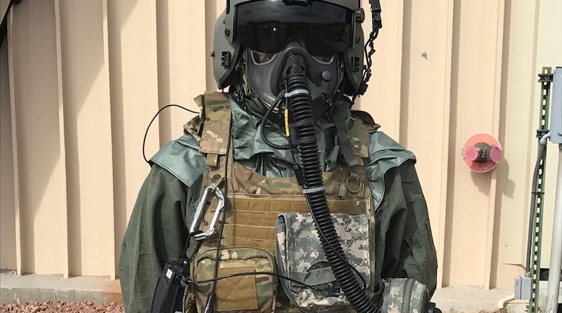 An Airman demonstrates the next-generation chemical, biological, radiological and nuclear protective mask known as the Joint Service Aircrew Mask - Rotary Wing during a test and fielding event. (Courtesy photo)