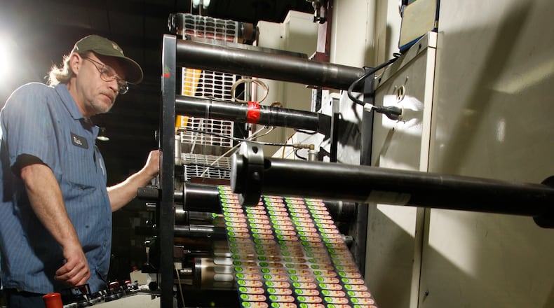 Pressman Rich Gebhart worked a narrow web Flexographic press at Hooven-Dayton Corp. Gebhart was printing labels for children’s toothbrushes when this 2011 photo was taken. TY GREENLEES/STAFF