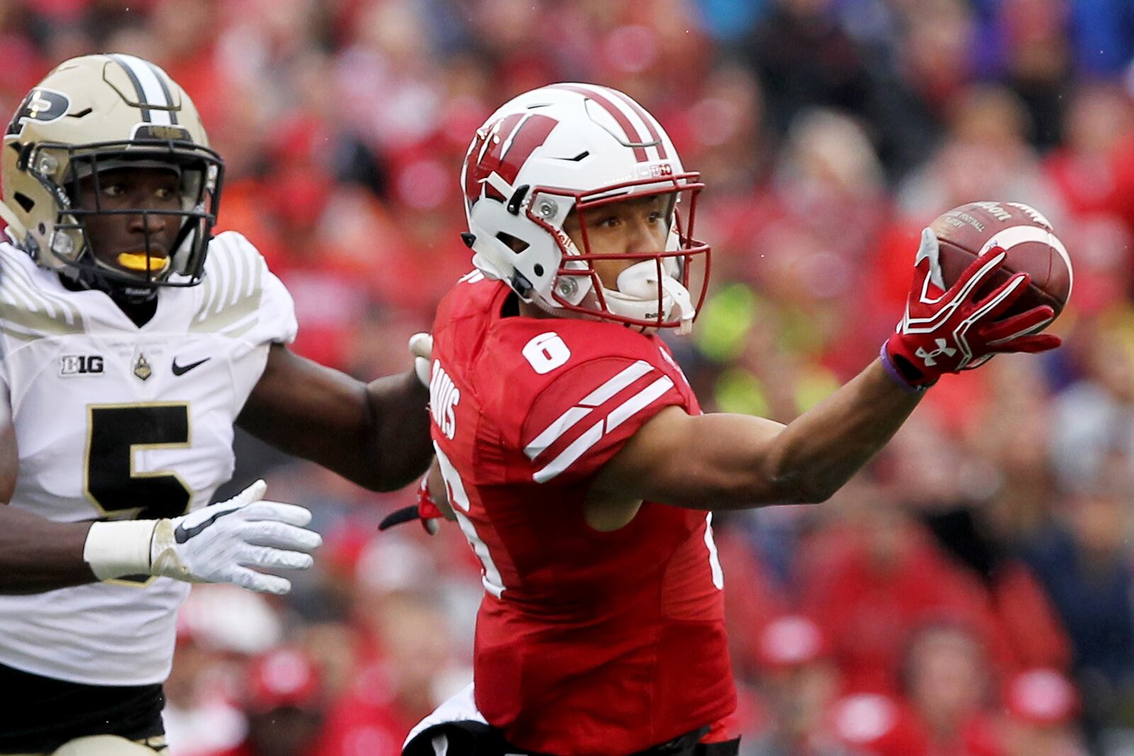 Danny Davis III of the Wisconsin Badgers attempts to make a catch while being guarded by T.J. Jallow of the Purdue Boilermakers in the second quarter at Camp Randall Stadium on October 14, 2017 in Madison, Wisconsin. (Photo by Dylan Buell/Getty Images)