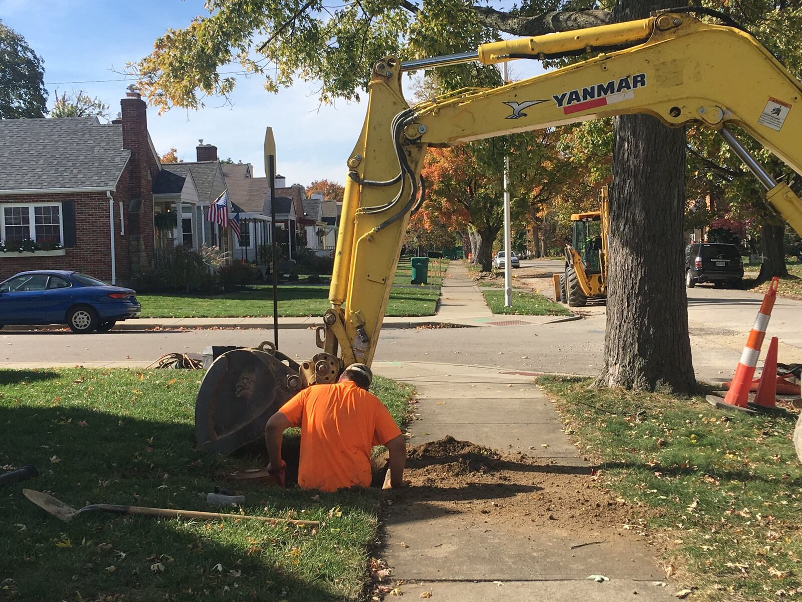 Workers dig up and replace a water main line on Cushing Avenue, off of Shroyer Road in Kettering. KARA DRISCOLL/STAFF