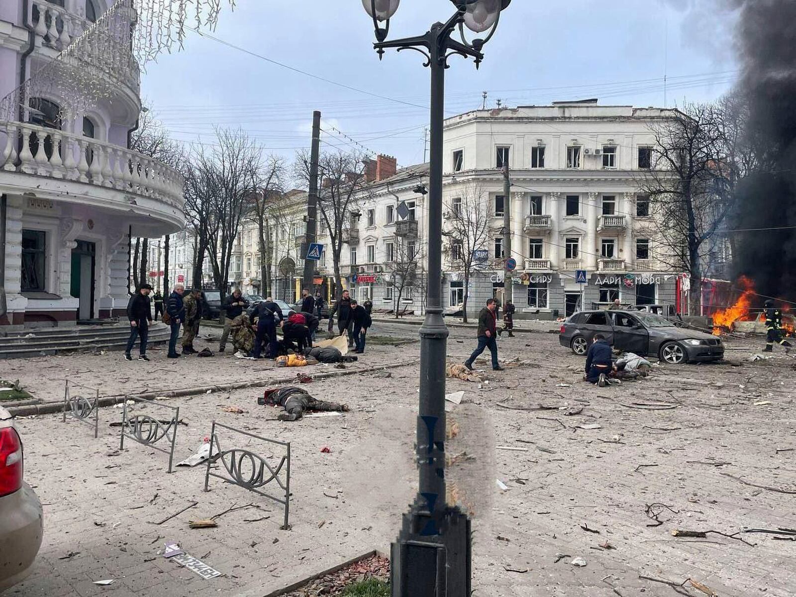 In this photo provided by the Ukrainian Parliament Commissioner for Human Rights Press Service, bodies of the killed residents lie on the ground following a Russia's missile attack that killed at least 20 civilians in Sumy, Ukraine, Sunday, April 13, 2025. (Ukrainian Parliament Commissioner for Human Rights Press Service via AP)