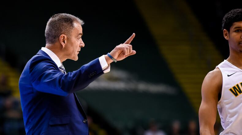 Wright State University head men’s basketball coach Scott Nagy signals to his team from the sideline during their game against Miami University Tuesday, Nov. 15 at the Nutter Center at Wright State University in Fairborn. NICK GRAHAM/STAFF
