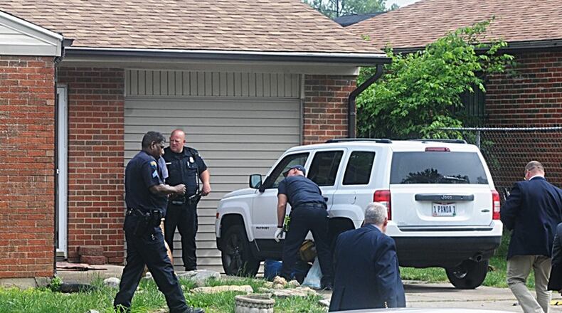 Claudena Marie Helton is charged with killing two of her children and forcing an older child to help her drag their bodies in the front yard of their home in May.