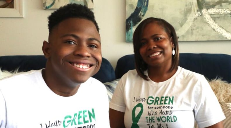 Tater Johnson and his mother, Narqueisha, at their Huber Heights home. BILL LACKEY/STAFF
