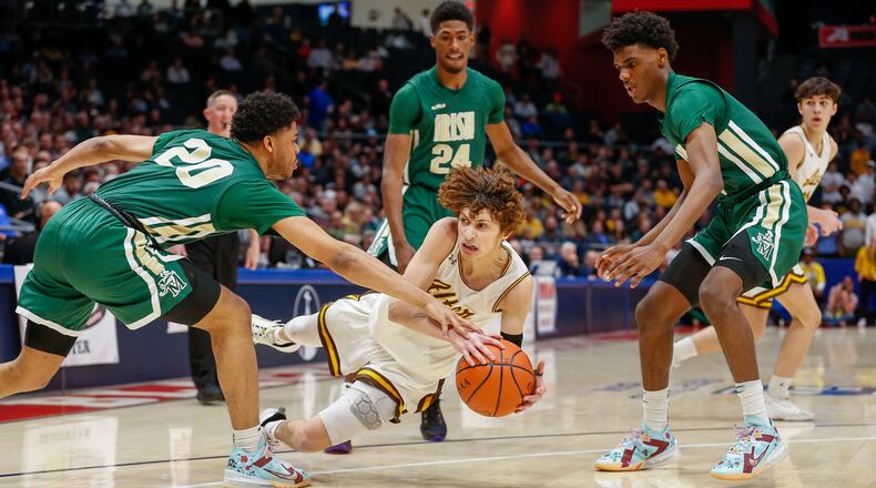 Alter High School senior Ryan Chew dives for a loose ball between several Akron St. Vincent-St. Mary's defenders during their Division II state semifinal game on Friday afternoon at UD Arena. Michael Cooper/CONTRIBUTED