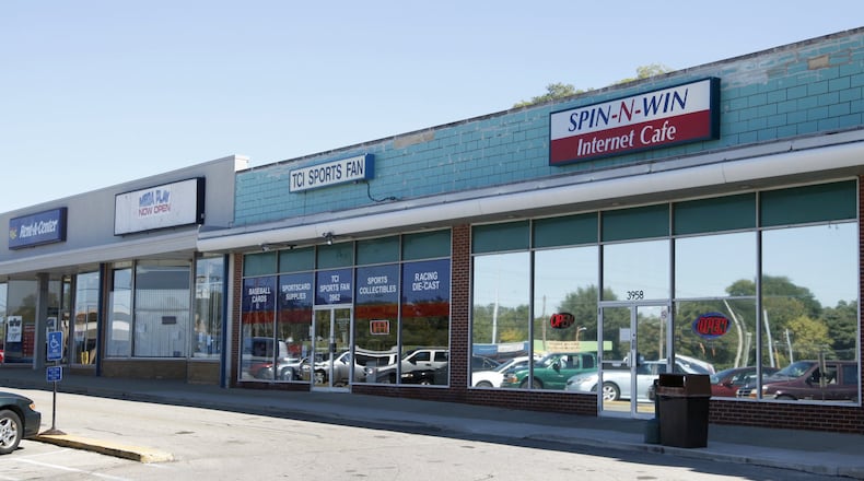 ORIGINAL CUTLINE: The Spin-In-Win Internet Cafe, 3958 Linden Ave. is located two doors down from Mega Play, 3964 Linden Ave. Dayton Internet sweepstakes cafes were the latest illegal game to pop up in Ohio’s young gambling scene, and experts and lawmakers say it won’t be the last.Gambling is illegal in Ohio, per the state Constitution, except for a handful of large, state-regulated games: State-run lottery, charitable gaming, four casinos and horse racing.The exceptions have carved out billions a year in revenues, some of which goes to schools, local governments and law enforcement and charities.But lawmakers, urged on by law enforcement and the state attorney general, decided Internet sweepstakes cafes don’t belong among Ohio’s games. Earlier this year, they enacted House Bill 7 to limit prize payouts to less than $10 and authorize the attorney general and Bureau of Criminal Investigation to raid cafes suspected of breaking the law.Cafe owners, who lure customers with the promise of big jackpots, say the limits would force them to close their doors. Owners are fighting back, gathering signatures for a referendum on the bill. But their efforts might be for naught, as lawmakers move forward a second bill that attempts to close cafes by limiting the percent of gross receipts a business can make from sweepstakes promotions.The plight of Internet cafes shows Ohio’s patchwork gaming laws leave room for new gambling operations and lawmakers are inclined to take creative routes to shutting them down. LISA POWELL /STAFF