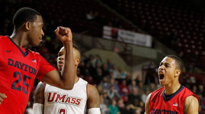 Dayton guard Kyle Davis, right, and Kendall Pollard celebrate after Davis scored and was fouled in the second half against Massachusetts on Thursday, Jan. 29, 2015, at Mullins Center in Amherst, Mass. David Jablonski/Staff