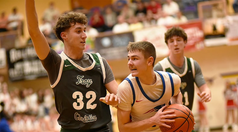 Tri-Village High School senior Trey Sagester tries to navigate the Troy Christian defense during their Division VI regional semifinal game on Tuesday, March 10, 2026 at the Vandalia Butler's Student Activity Center. GEOFF NEVILLE / CONTRIBUTED PHOTO