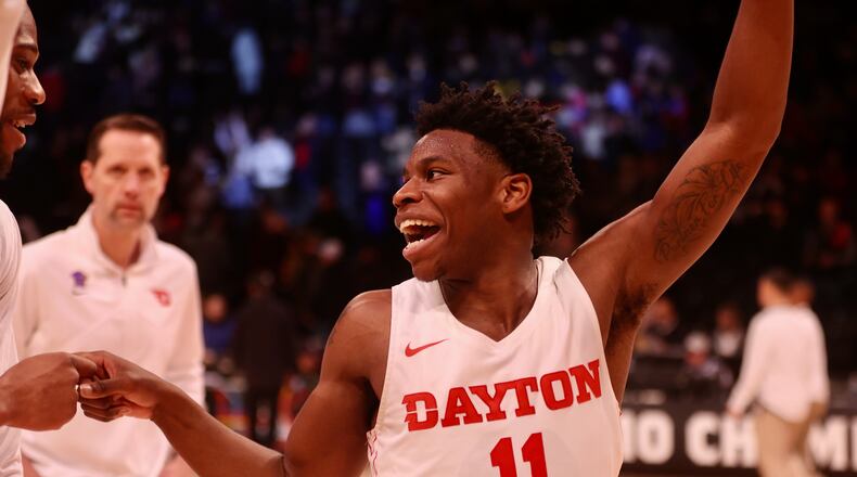 Dayton's Malachi Smith celebrates after a victory against Fordham in the semifinals of the Atlantic 10 Conference tournament on Saturday, March 11, 2023, at the Barclays Center in Brooklyn, N.Y. David Jablonski/Staff