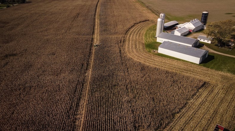 A farmer harvests crops on his land in western Montgomery County. The value of farmland that uses state tax savings programs is expected to jump 78% on average locally. JIM NOELKER/STAFF