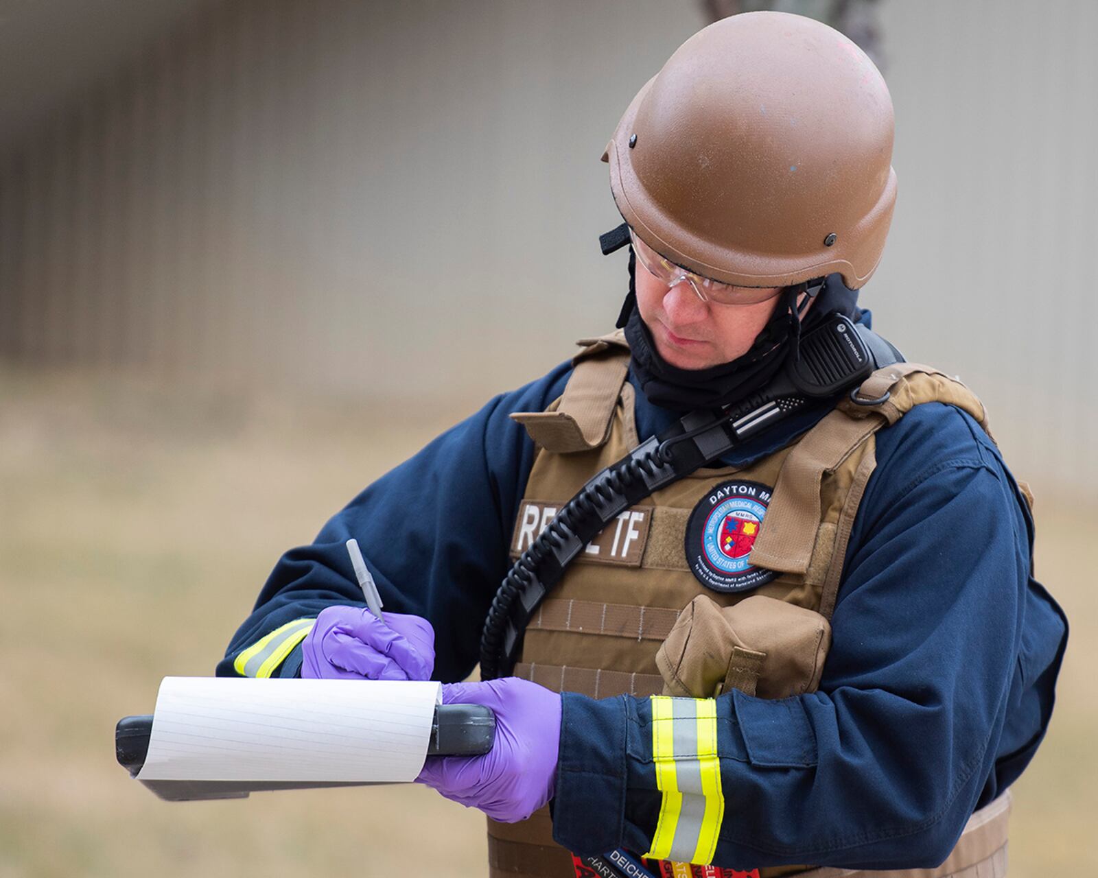A Fire Department paramedic with the 788th Civil Engineer Squadron keeps track of the “dead” and “wounded” during an active-shooter exercise Feb. 23 at Wright-Patterson Air Force Base. The exercise gave first responders, including police, fire and medical personnel, the opportunity to practice coordinating emergency actions and procedures. U.S. AIR FORCE PHOTO/R.J. ORIEZ