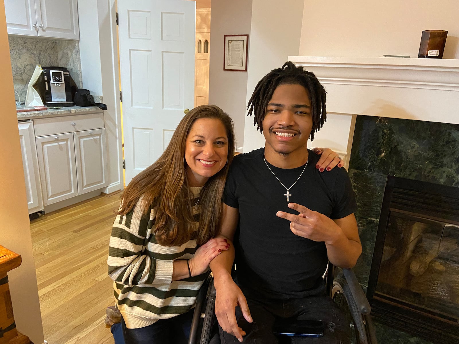 Lesley Jones (Left) with Jahkari Jackson, who has been family since surviving a 2021 shooting. His strength and presence have deeply shaped her personal journey. CONTRIBUTED