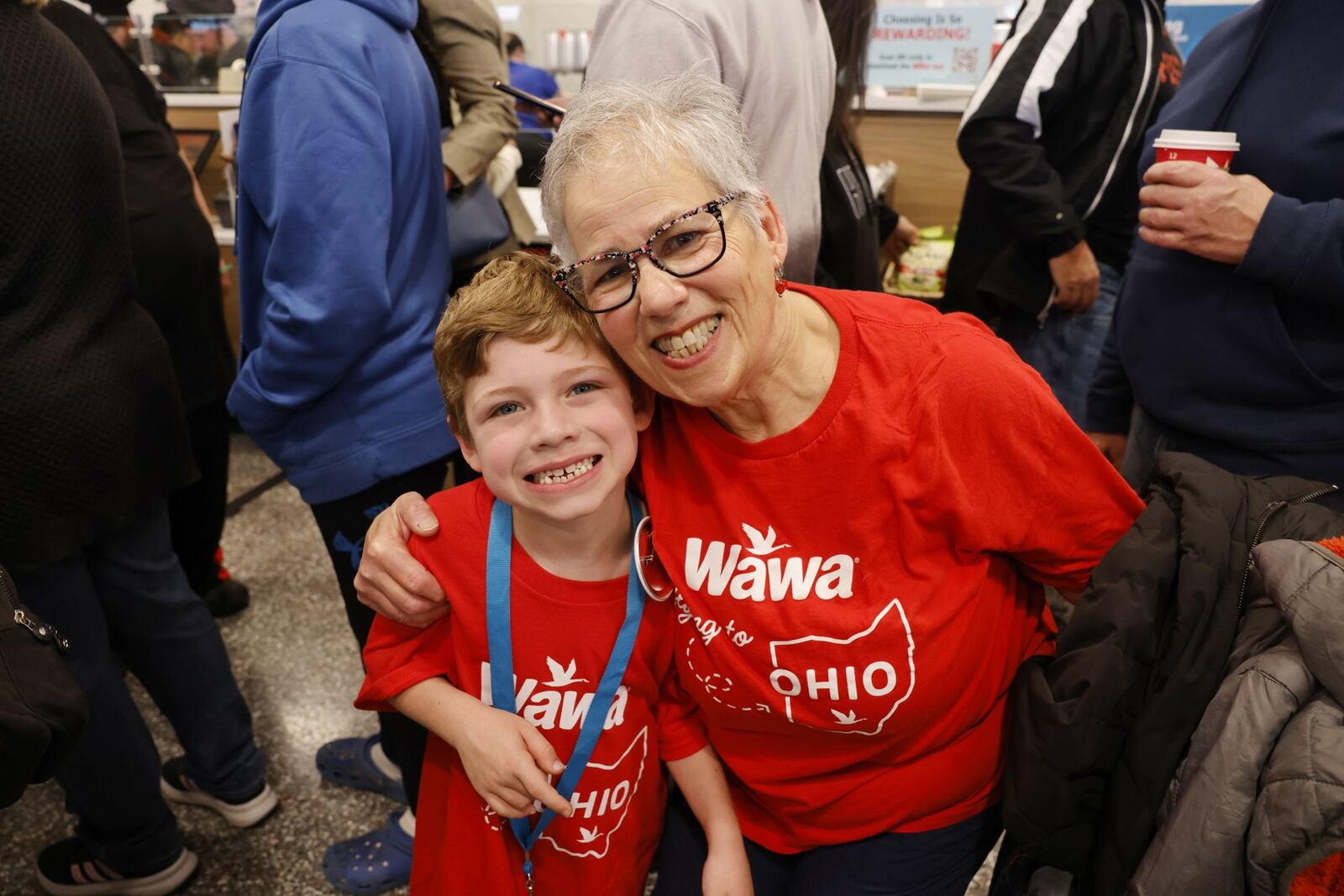 Michel Venturini and Henry Venturini, 7, were the first people in the door at a VIP event Tuesday, April 15, 2025 for Ohio's first Wawa on Cincinnati Dayton Road in Liberty Township. The grand opening is Wednesday. NICK GRAHAM/STAFF