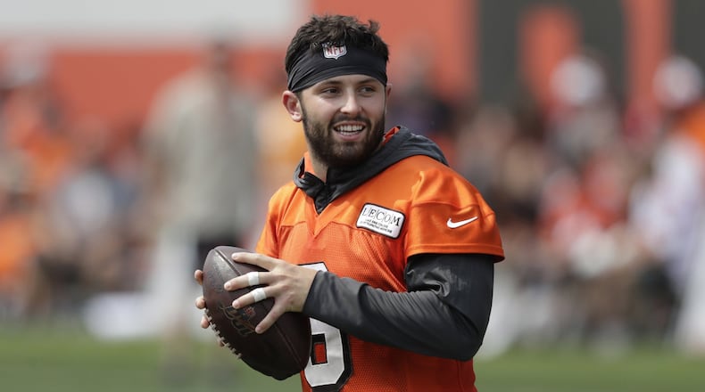 FILE - In this July 26, 2019, file photo, Cleveland Browns quarterback Baker Mayfield looks to throw during practice at the NFL football team’s training camp facility in Berea, Ohio. Mayfield isn’t concerned about the huge expectations being placed on the Browns, who went 7-8-1 during his rookie season but upgraded their roster and should compete for their first playoff spot since 2002. (AP Photo/Tony Dejak, File)