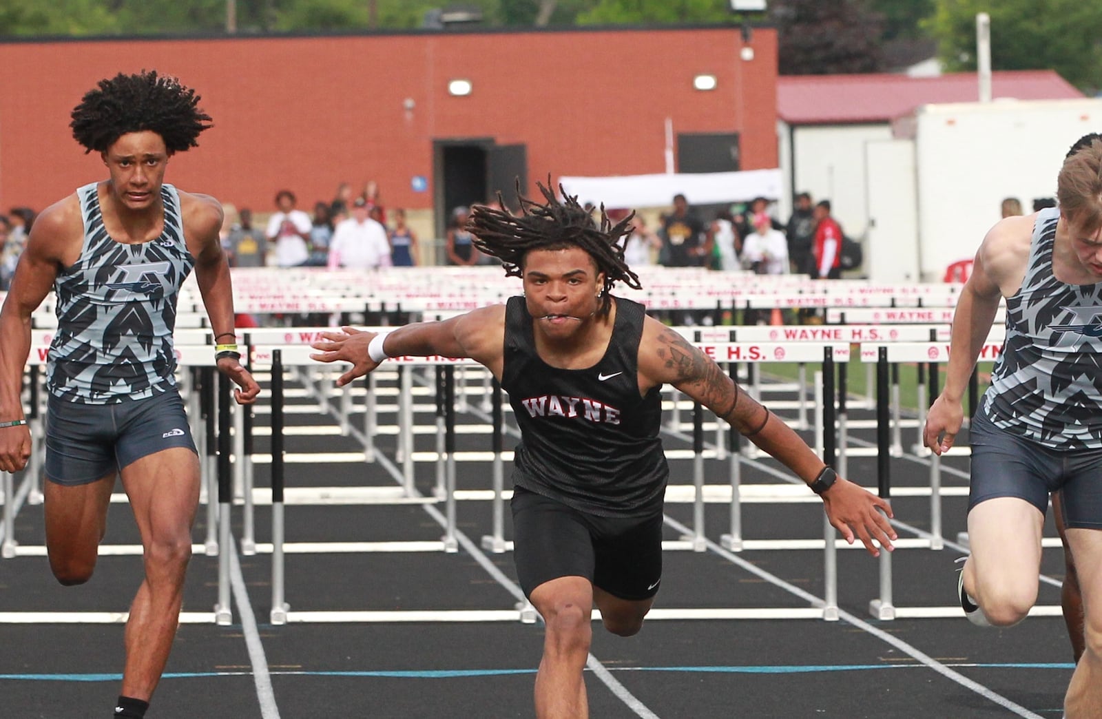 Keng Martin of Wayne wins the 100-meter hurdles 2025 GWOC track meet at Heidkamp Stadium in Huber Heights on May 14.