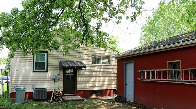 Access to the basement is off the kitchen. A door at the landing leads to the private back yard. The property includes a 1-car, detached garage.