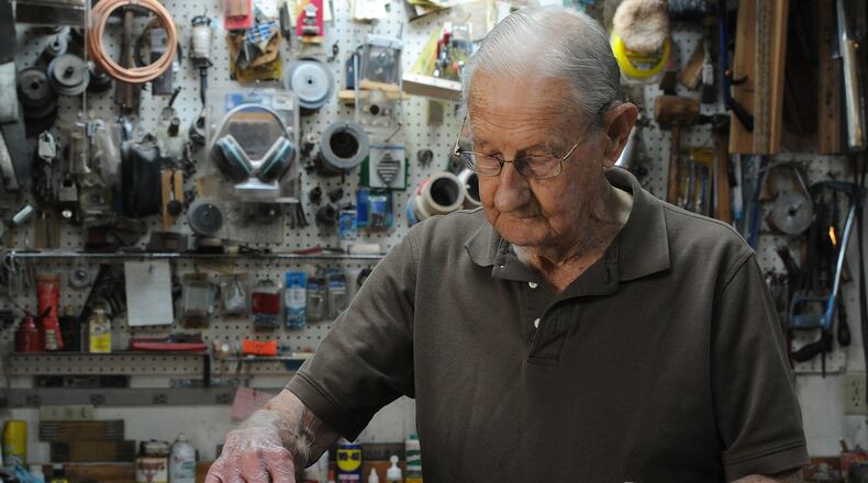 Julius "Duke' Knake works in his woodshop at his home in Huber Heights. Knake does woodworking and light metal work free for People who need it. MARSHAL GORBY\STAFF