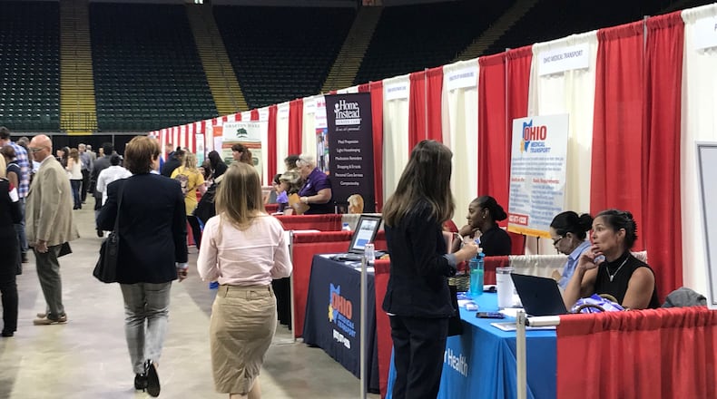 Job seekers look into positions at other job fairs. In today’s economy, workers have the upper hand.