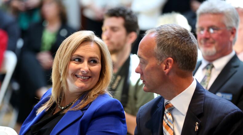 Kristi Tanner, an executive overseeing automotive investments for Jobs Ohio, with Jeff Hoagland, president and chief executive of the Dayton Development Coalition, at a 2015 event at Carillon Historical Park. LISA POWELL/STAFF