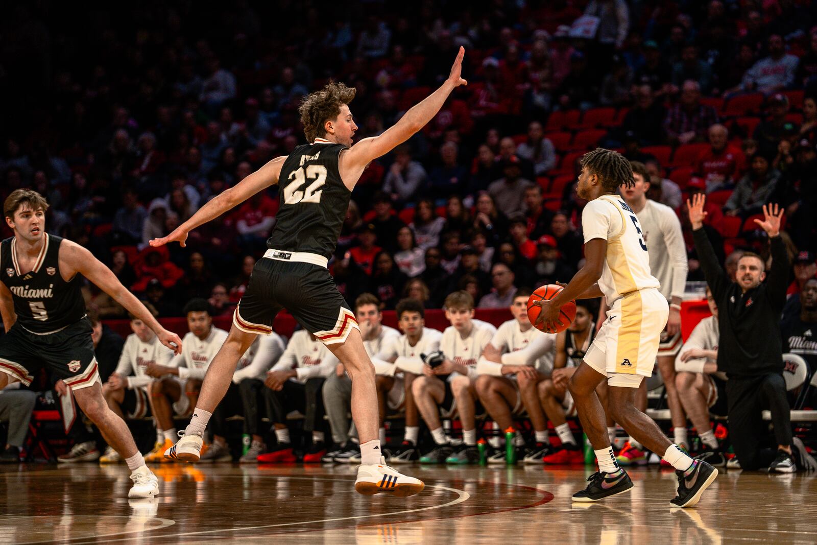 Miami University's Brant Byers reaches out to contest a shot during their game against Akron on Saturday, Jan. 3, 2026 at Millet Hall in Oxford. WILL MIKLAUTSCH / CONTRIBUTED PHOTO