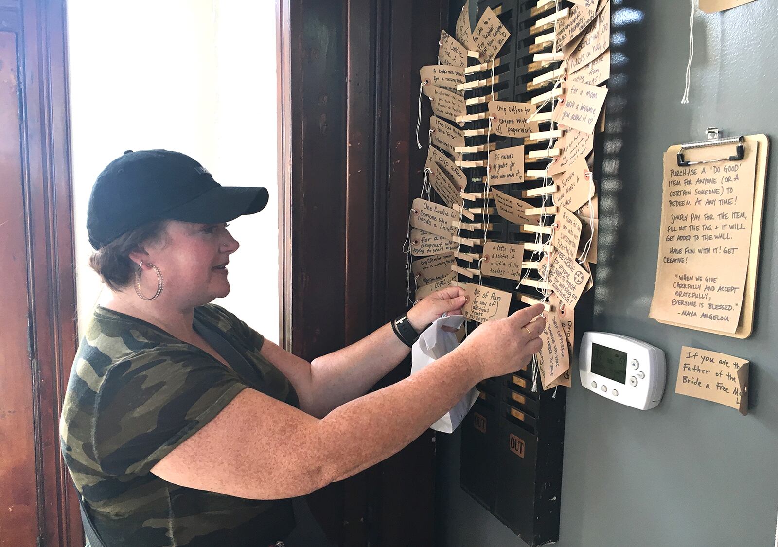 "I just love this city and I'd do anything I can to make someone feel better," said Amanda DeLotelle of Dayton Friday morning after purchasing a gift and writing on her ticket, $5 of fun by way of delicious treats. Love you Dayton." LISA POWELL / STAFF