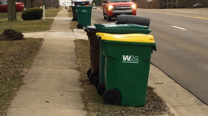 Thousands of Waste Management Inc.’s containers were left with former customers in Miami Twp. after the trash hauler’s contract expired at the end of 2017. The issue created a “disaster,” one township official said, resulting in new contractor Rumpke of Ohio obtaining a waiver from WMI to collect the bins. NICK BLIZZARD/STAFF