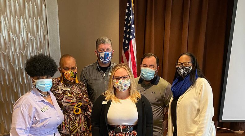Sherita Smith (far left), ASPIRE program manager, recognizes participants during a completion ceremony Nov. 4 at Wright-Patterson Air Force Base. Pictured are: Sarah Burkhart (front), Community Services. Back row, from left: Latonya Johnson, Force Development; Theodore Thomas, Resources; Raymond Owens, Operations; and Aleah Corbitt, Child and Youth Program. U.S. AIR FORCE PHOTO/MEGAN MUDERSBACH