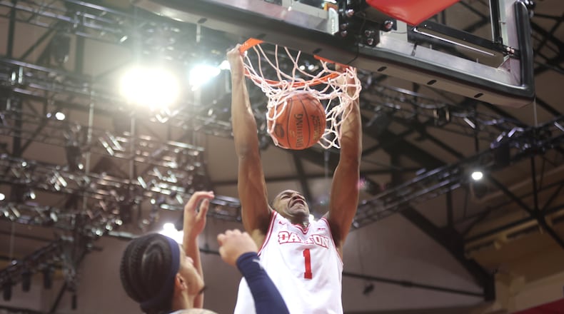 Dayton's Malcolm Thomas dunks in the first half against Georgetown on Thursday, Nov. 27, 2025, at the State Farm Field House in Kissimmee, Fla. David Jablonski/Staff