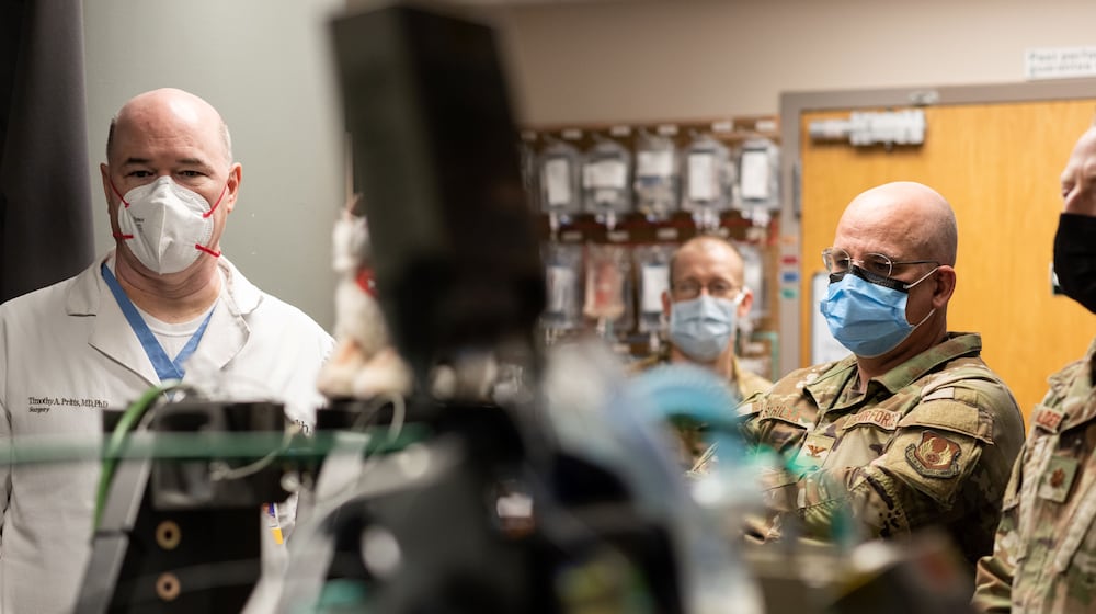 From left to right: Dr. Timothy Pritts, division chief of general surgery and vice chair of clinical operations at UC Health and professor in the Department of Surgery at the UC College of Medicine works with US Air Force personnel on site at UC Medical Center. UC Health photo