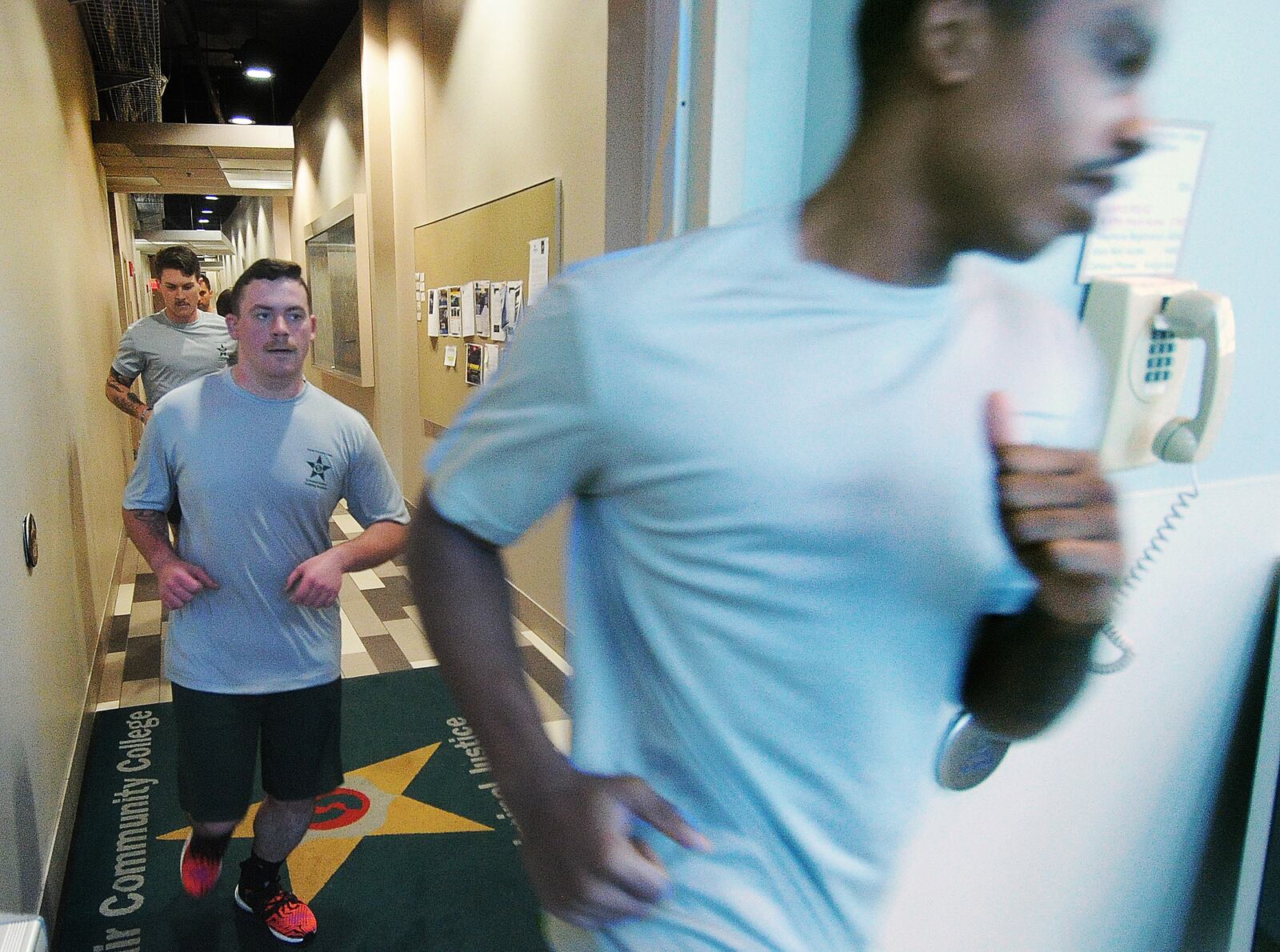 Police cadets run a circuit through the halls at Sinclair Community College, Thursday, Jan. 11, 2024. MARSHALL GORBY\STAFF