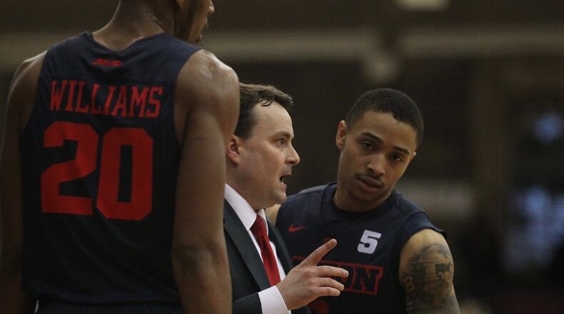 Dayton’s Kyle Davis talks to Archie Miller during a game against Fordham on Tuesday, Jan. 31, 2017, at Rose Hill Gym in Bronx, N.Y. David Jablonski/Staff