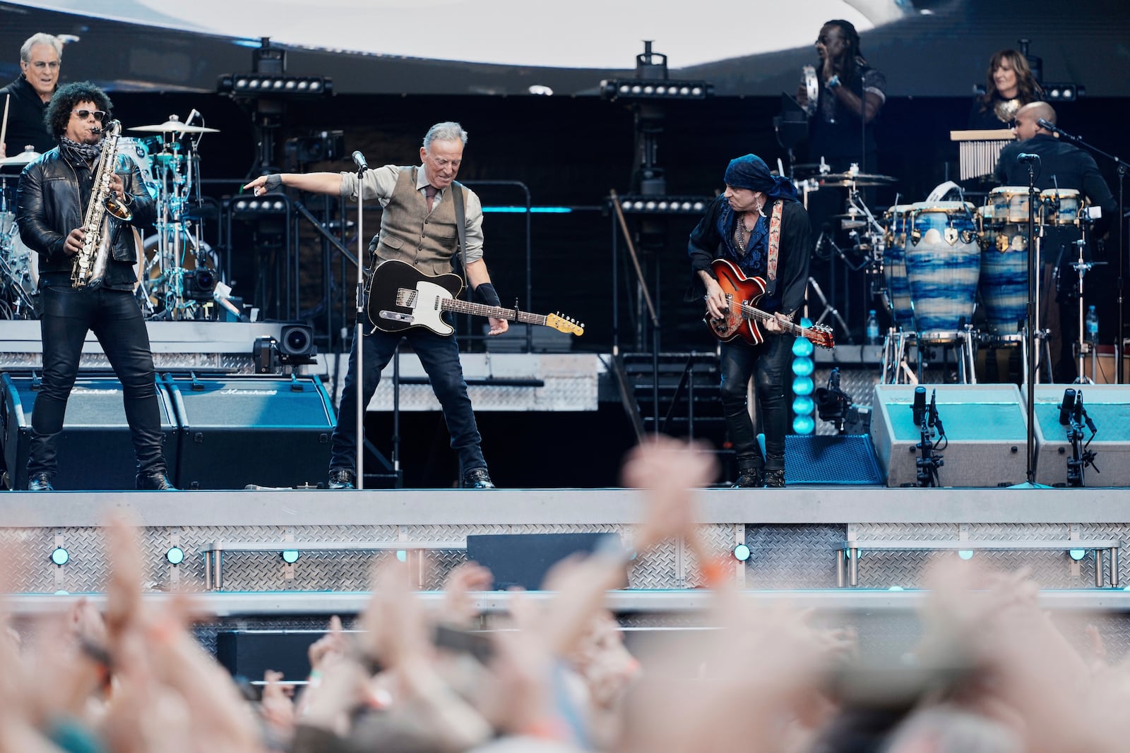 Bruce Springsteen, center, performs with the E Street Band at the Olympic Stadium in Berlin, Germany, Wednesday, June 11, 2025. (AP Photo/Markus Schreiber)