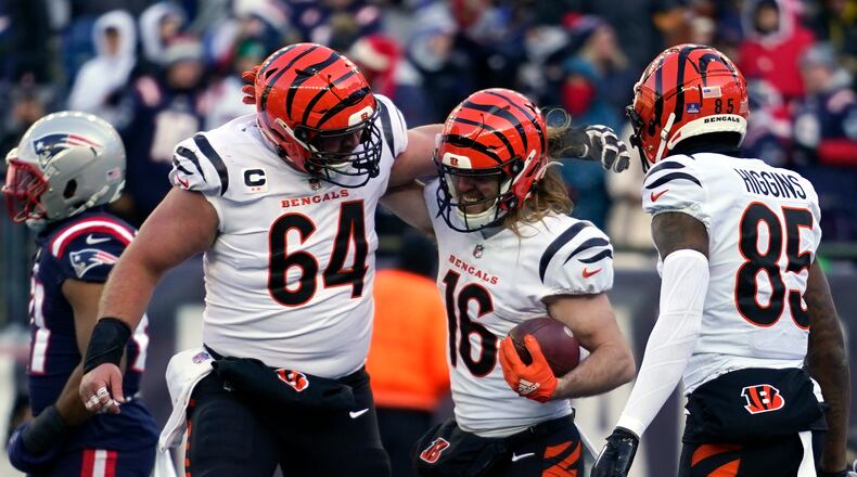 Cincinnati Bengals wide receiver Trenton Irwin (16) celebrates his touchdown with center Ted Karras (64) and wide receiver Tee Higgins (85) during the first half of an NFL football game against the New England Patriots, Saturday, Dec. 24, 2022, in Foxborough, Mass. (AP Photo/Charles Krupa)