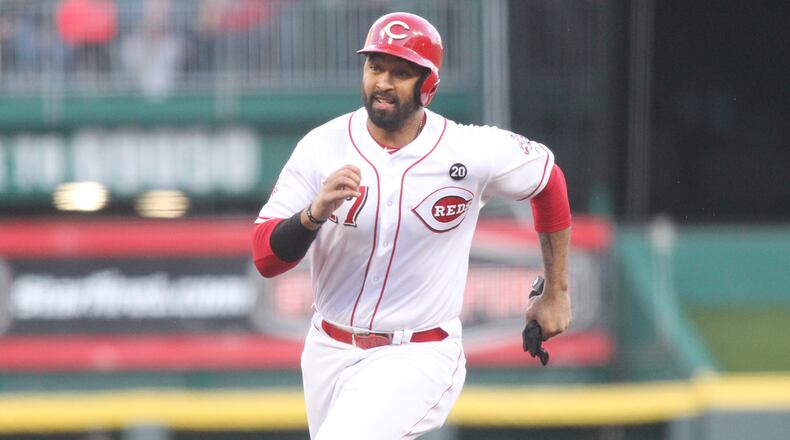 The Reds Matt Kemp runs to third base against the Marlins on Tuesday, April 9, 2019, at Great American Ball Park in Cincinnati. David Jablonski/Staff