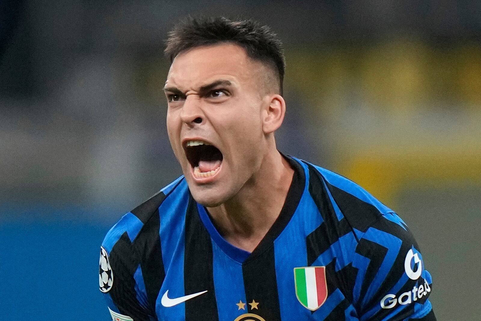 Inter Milan's Lautaro Martinez celebrates at the end of the Champions League quarterfinal second leg soccer match between Inter Milan and Bayern Munich at the San Siro stadium in Milan, Italy, Wednesday, April 16, 2025. (AP Photo/Luca Bruno)