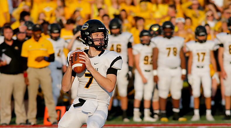 Centerville quarterback Alec Grandin looks for a receiver during their game at Fairfield Friday, August 25, 2017. Contributed photo by E.L. Hubbard