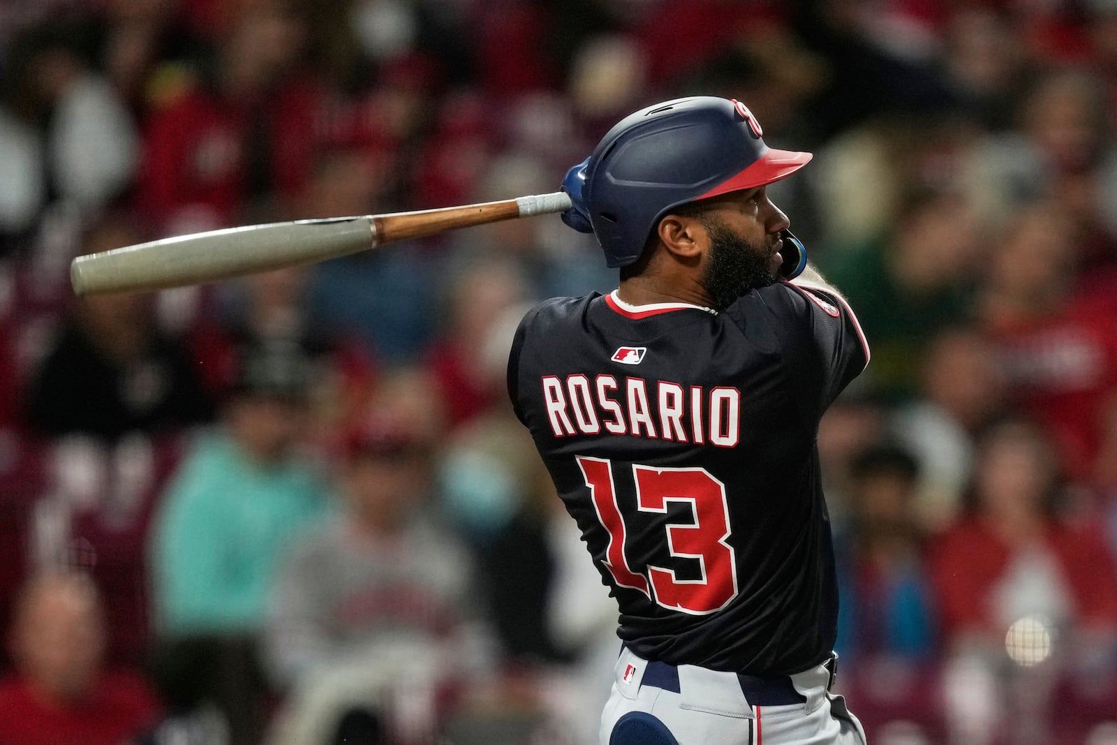 Washington Nationals' Amed Rosario watches his three-run home run in the sixth inning of a baseball game against the Cincinnati Reds, Saturday, May 3, 2025, in Cincinnati. (AP Photo/Carolyn Kaster)